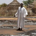 standing wearing white