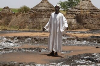 standing wearing white